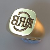 Deep reverse seal style initials engraved