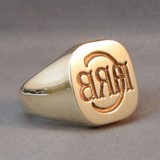 Deep reverse seal style initials engraved